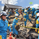 Officer Hideo Shimura (left) and his cloned selves attempt to free quake victims trapped under rubble.